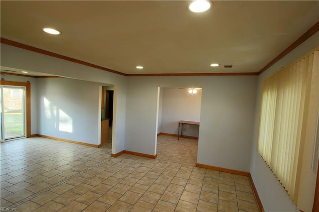 spare room featuring crown molding and light tile patterned flooring