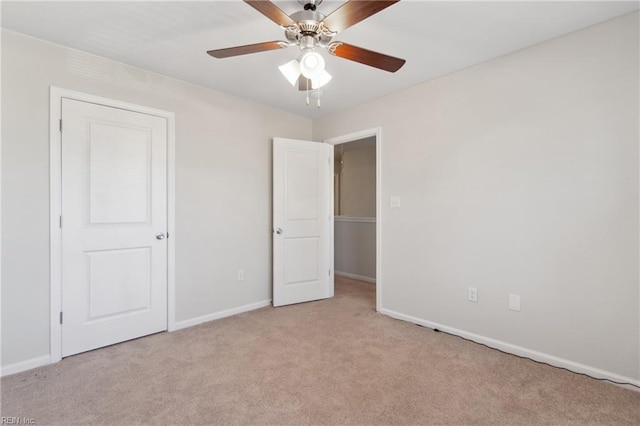 unfurnished bedroom with light carpet and ceiling fan