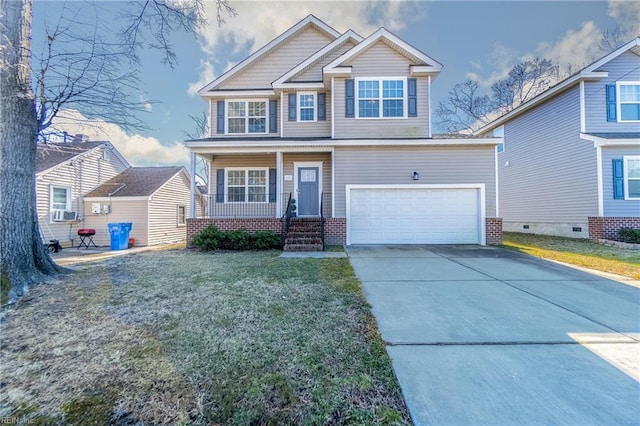 craftsman-style home with a porch, a garage, and a front yard