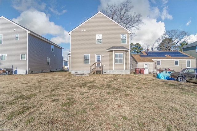 back of house with a lawn