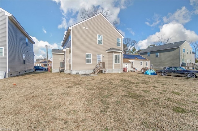 rear view of house with a lawn