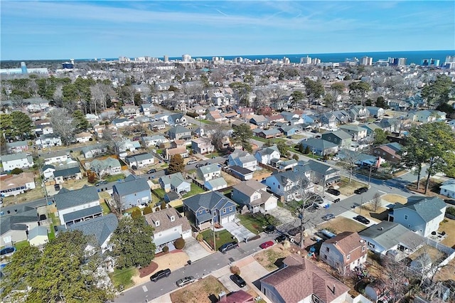 bird's eye view with a residential view and a water view