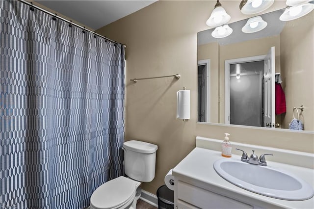 bathroom with vanity, toilet, and a shower with shower curtain