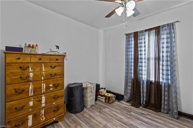 bedroom featuring multiple windows, ceiling fan, and light hardwood / wood-style floors