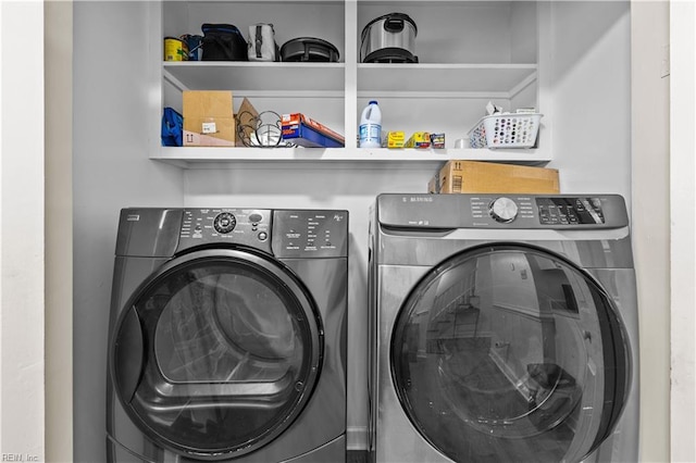 washroom with washing machine and dryer