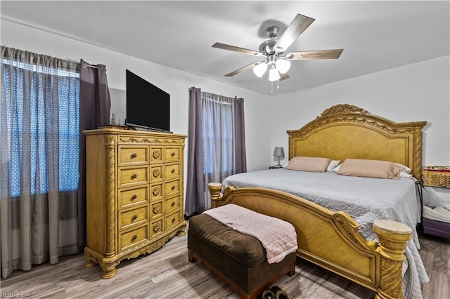 bedroom featuring ceiling fan and wood-type flooring