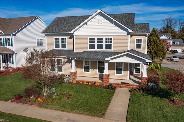 view of front facade featuring a porch and a front lawn