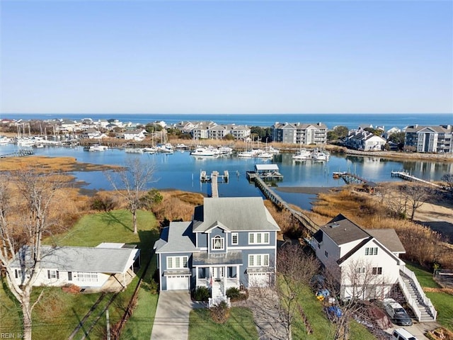 birds eye view of property featuring a water view