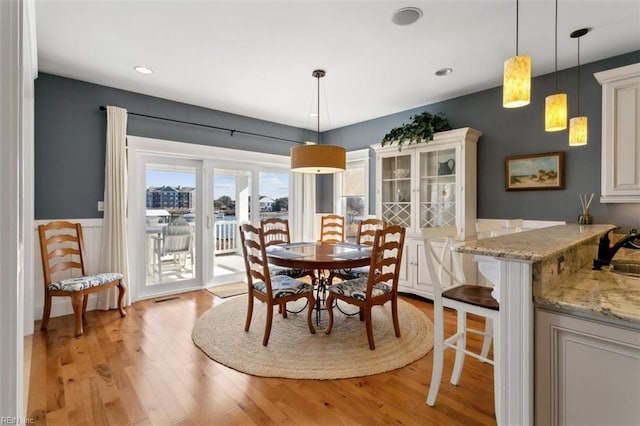 dining room featuring light hardwood / wood-style flooring