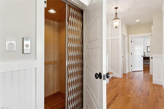 corridor featuring hardwood / wood-style flooring