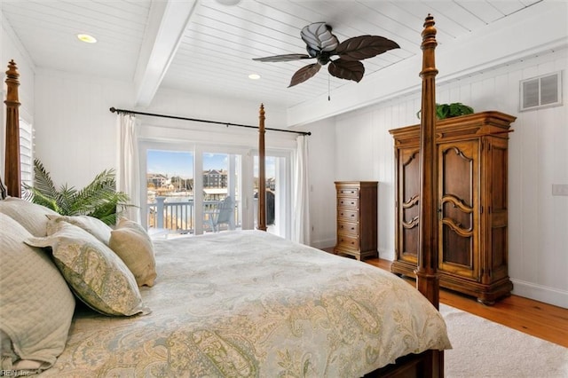 bedroom with wood ceiling, ceiling fan, light hardwood / wood-style floors, access to outside, and beamed ceiling