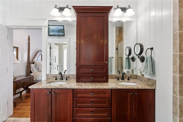 bathroom with vanity and hardwood / wood-style floors