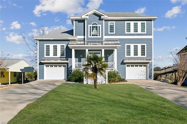 view of front of home featuring a garage and a front lawn