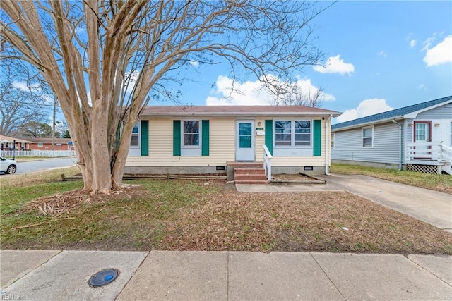 ranch-style home with a front yard