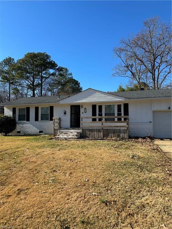 single story home with a garage and a front yard