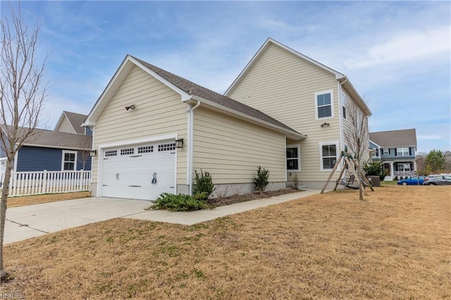 exterior space with a garage and a yard