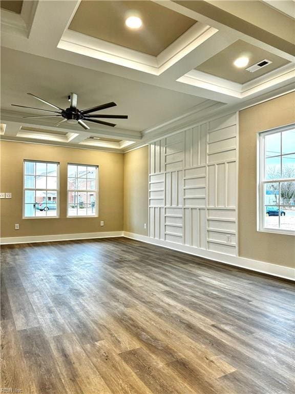 unfurnished living room with hardwood / wood-style flooring, coffered ceiling, ceiling fan, a raised ceiling, and crown molding