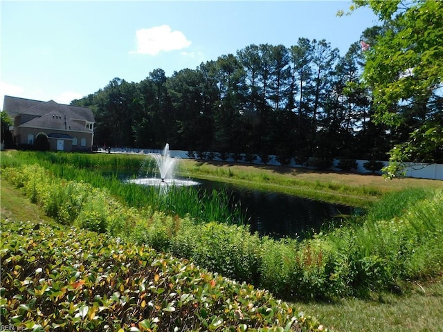 surrounding community featuring a water view