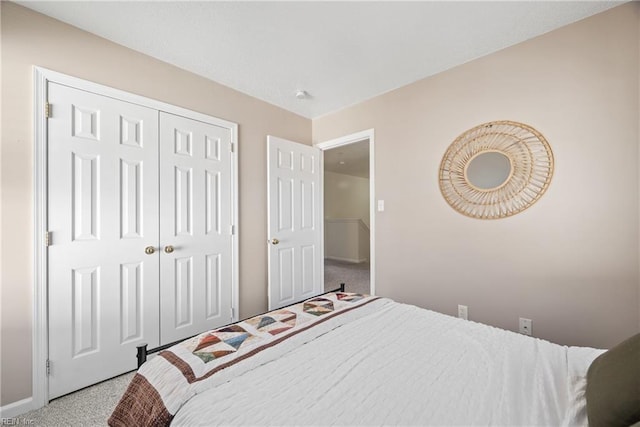 carpeted bedroom with a closet