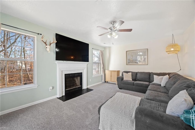 carpeted living room featuring ceiling fan