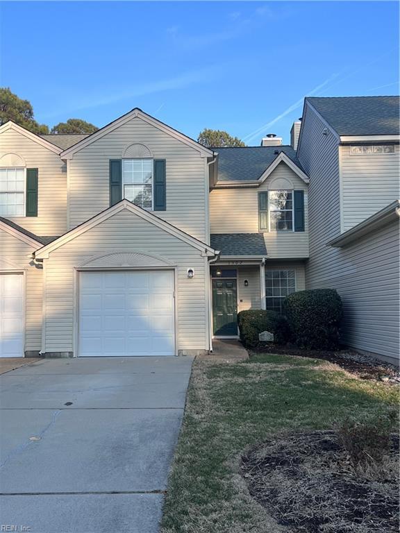 view of front property with a garage and a front yard