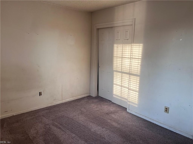 unfurnished room with carpet flooring