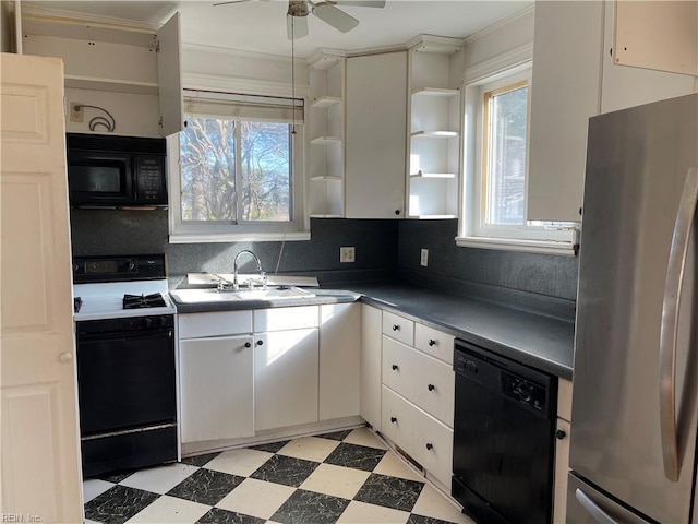 kitchen featuring sink, black appliances, ceiling fan, decorative backsplash, and white cabinets