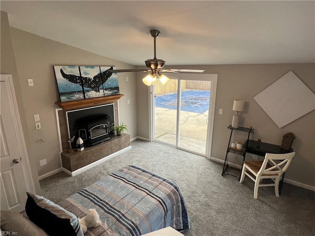 carpeted bedroom with vaulted ceiling, access to exterior, and ceiling fan