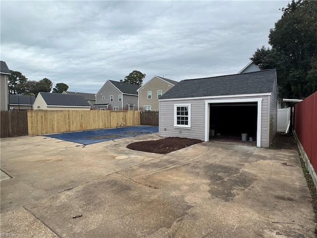 view of patio / terrace featuring an outbuilding and a garage