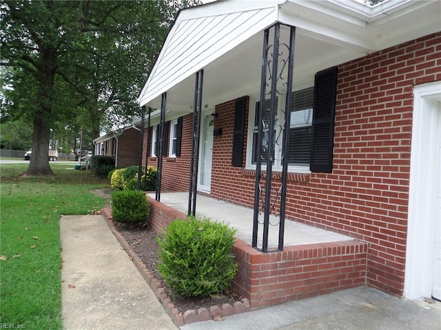 view of property exterior with a porch and a yard