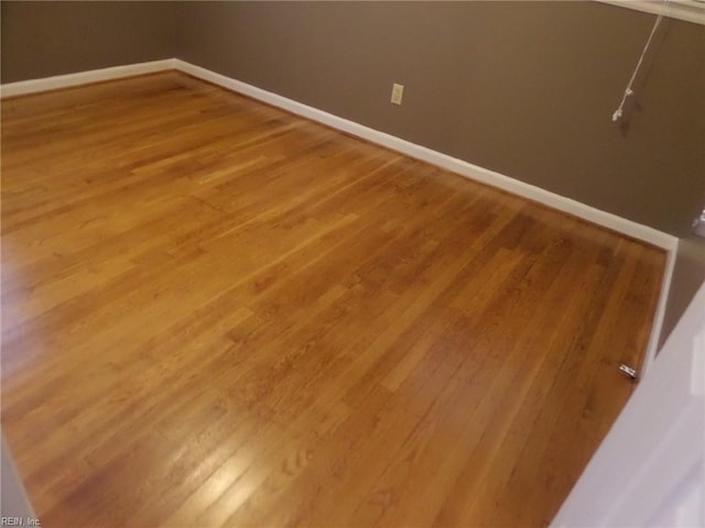 spare room featuring hardwood / wood-style floors