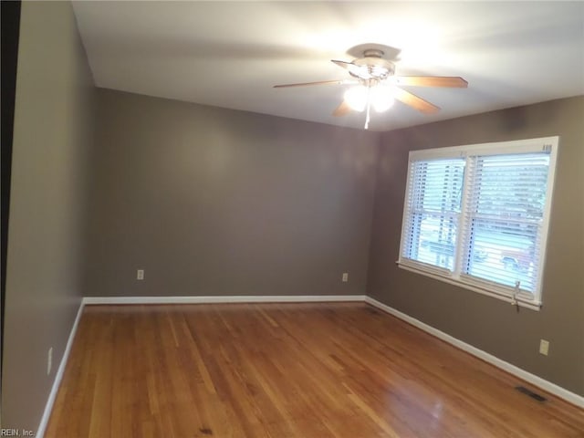 empty room with wood-type flooring and ceiling fan