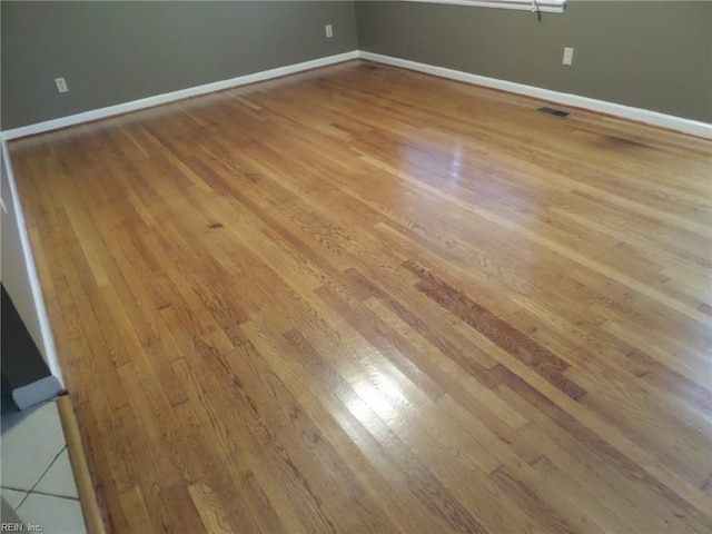 empty room with light wood-type flooring