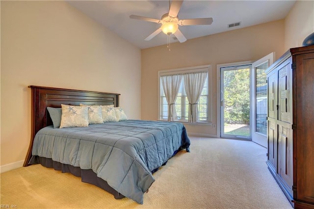 carpeted bedroom featuring access to exterior and ceiling fan