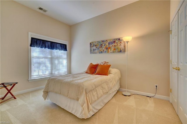 bedroom with carpet flooring and a closet