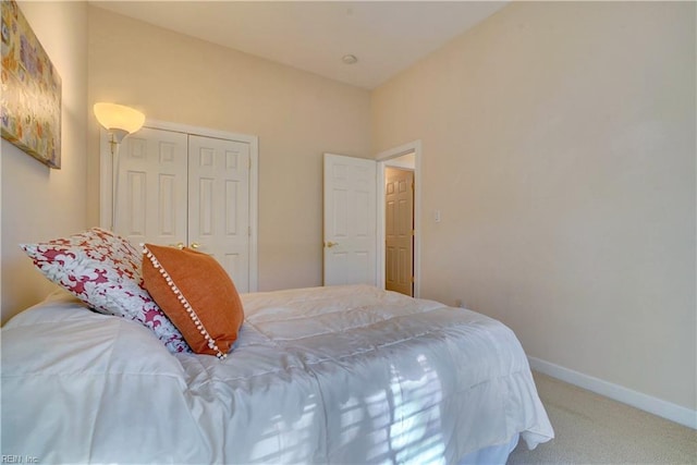 bedroom featuring a closet and carpet