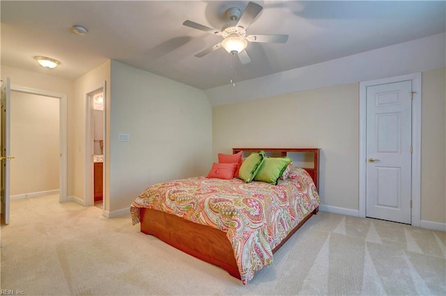 bedroom featuring ceiling fan, vaulted ceiling, and light carpet