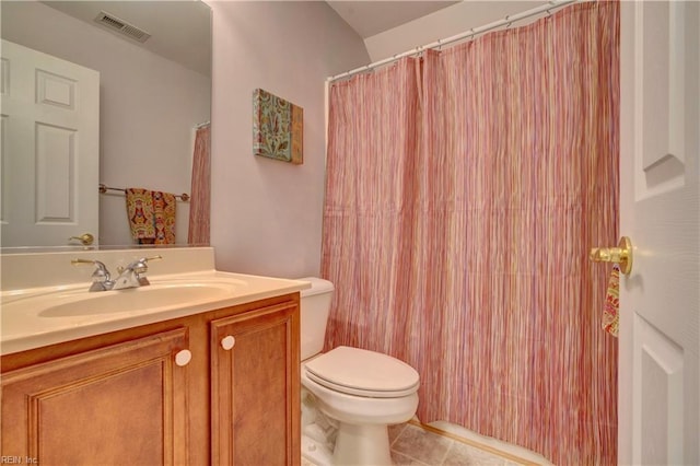 bathroom with tile patterned floors, vanity, and toilet