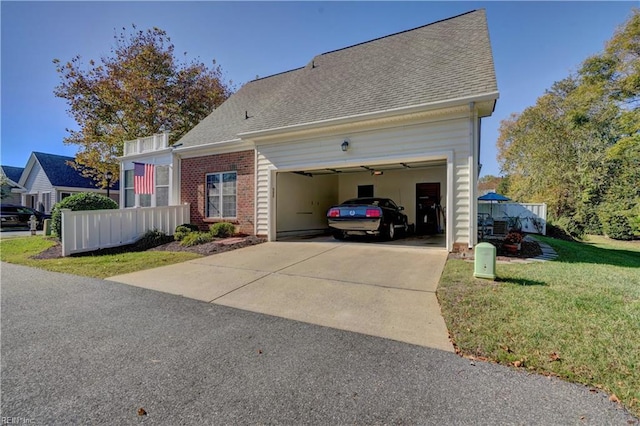 view of home's exterior with a garage and a yard