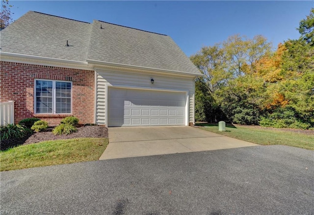 view of side of home featuring a garage