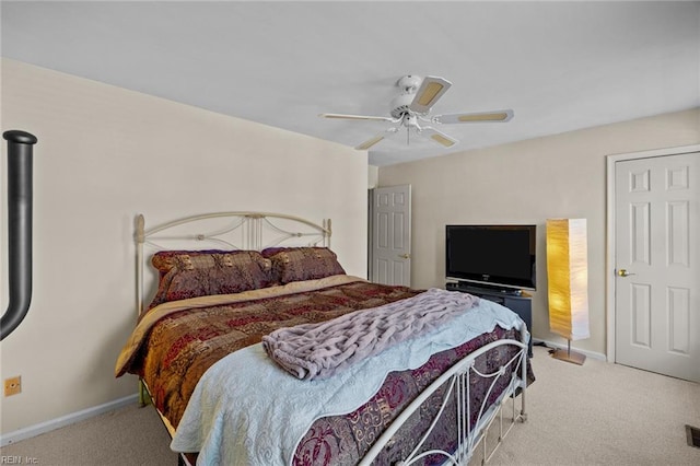 bedroom with light carpet and ceiling fan