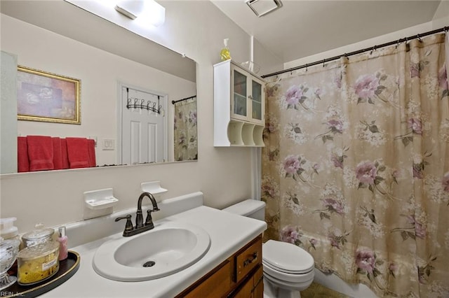 full bathroom with vanity, toilet, and shower / bath combo with shower curtain