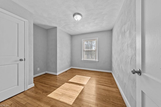 unfurnished room featuring light hardwood / wood-style flooring