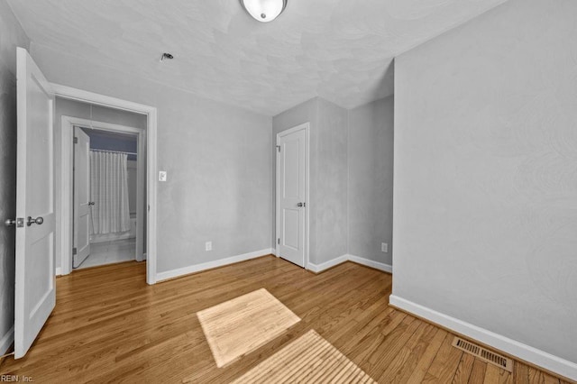 unfurnished bedroom with light hardwood / wood-style floors