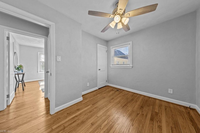 unfurnished bedroom with light hardwood / wood-style flooring and ceiling fan