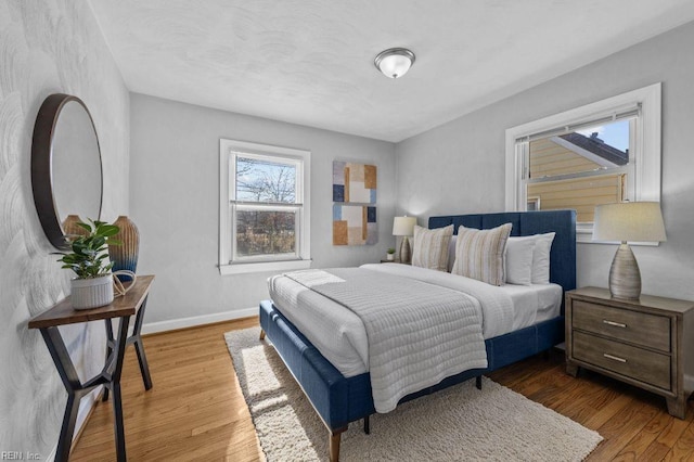 bedroom with hardwood / wood-style floors