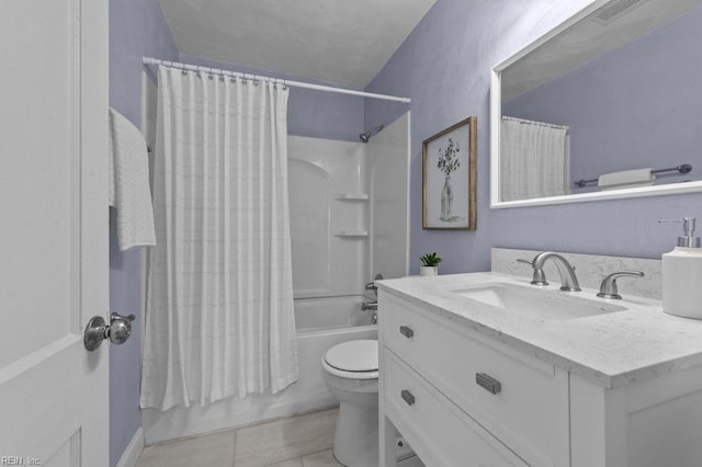 full bathroom with tile patterned flooring, vanity, shower / bath combination with curtain, and toilet