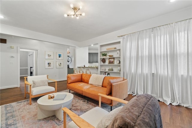 living room featuring hardwood / wood-style floors and a chandelier