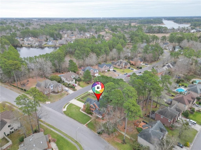 birds eye view of property with a water view