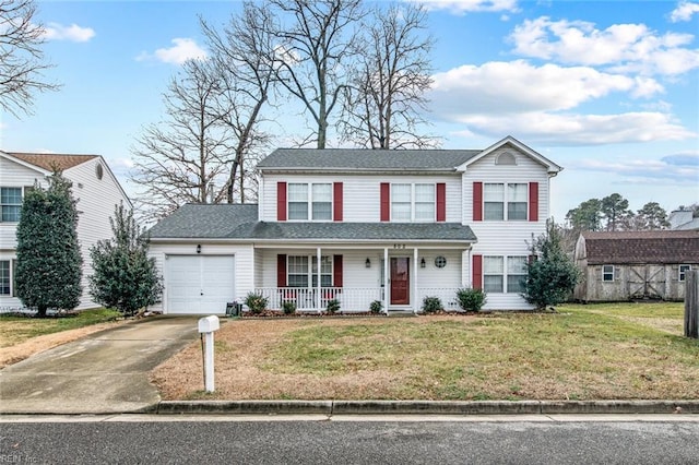 view of property featuring a garage, covered porch, and a front lawn